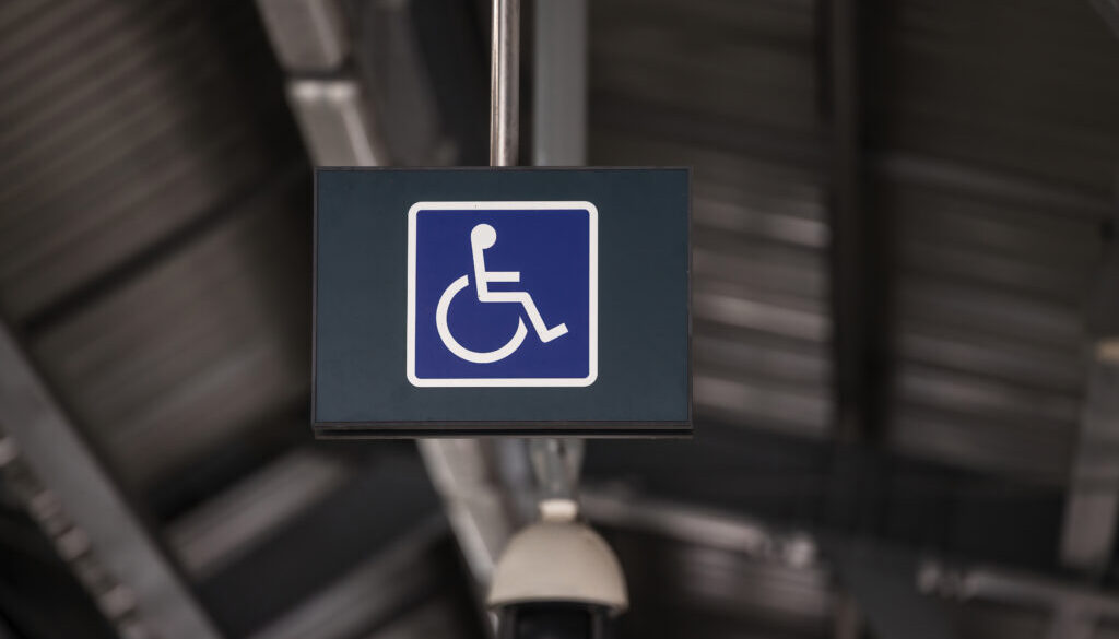 Accessible Elevator with sign. Disabled persons lift near modern