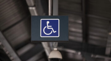 Accessible Elevator with sign. Disabled persons lift near modern